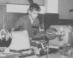 Young Juan Xuna working at a lathe