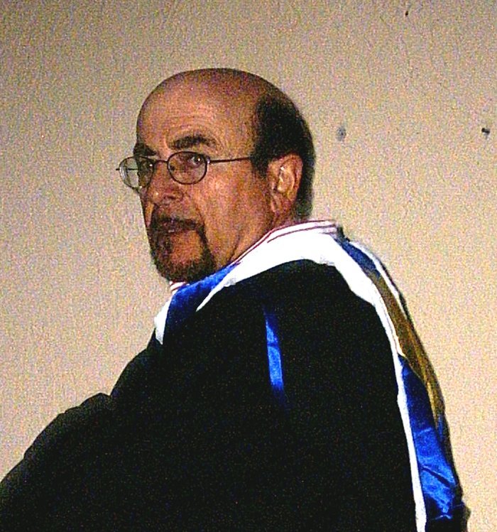 John Xuna in academic gown